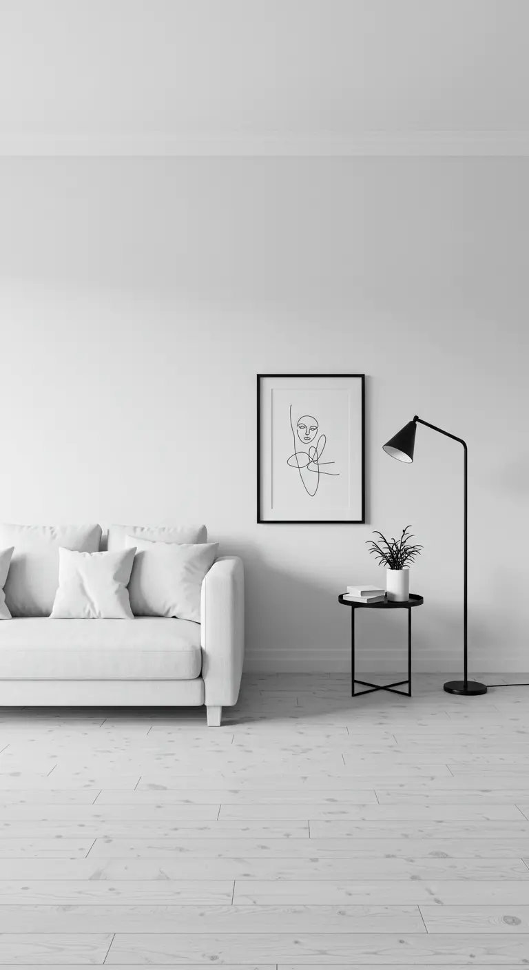 Sala minimalista totalmente blanca con un sofá, una lámpara y un único cuadro de arte lineal.